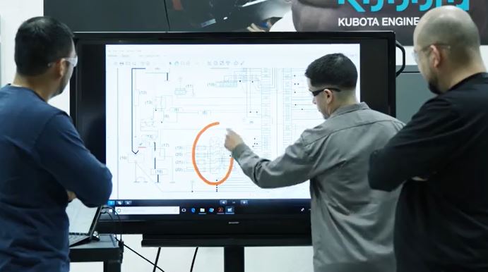 3 men using a digital whiteboard to map out engine functions